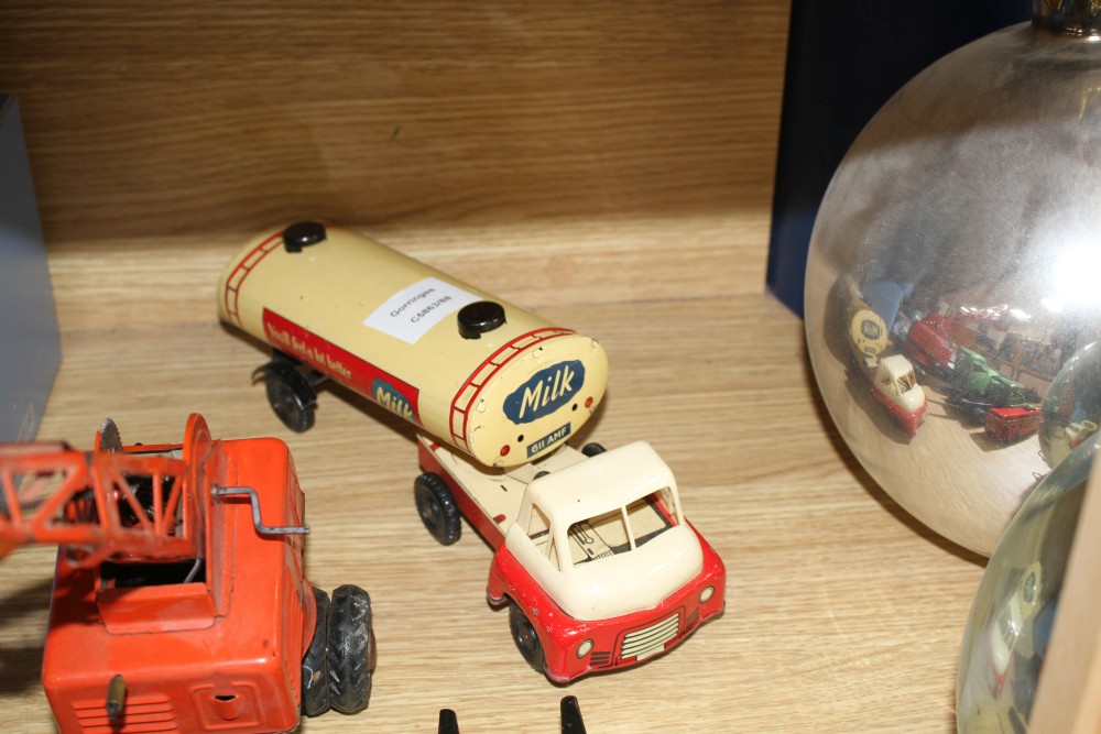 A group of assorted tinplate and diecast toys